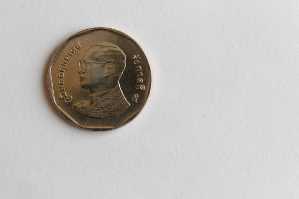 istock One Thai coin denomination is 5 baht lie on isolated white background - back side 898777594