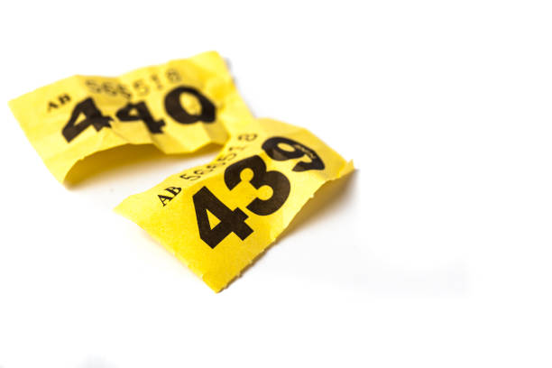 istock Screwed Up Yellow raffle ticket. Losing number 898785990
