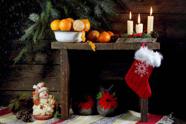 istock New Year's composition with tangerines and candles on a bench 898801506