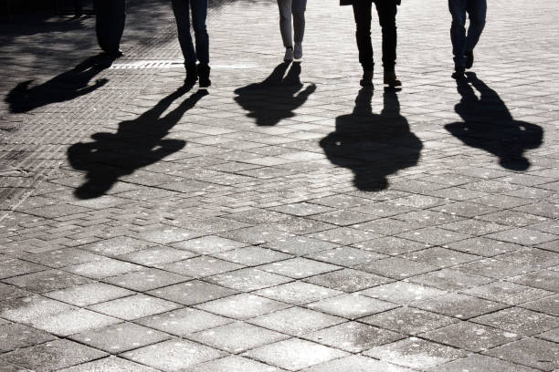 Leegs and shadow of five people stock photo