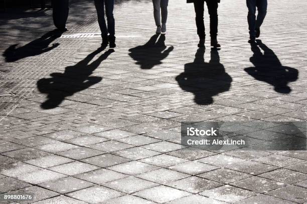 Leegs And Shadow Of Five People Stock Photo - Download Image Now - Shadow, People, Black And White