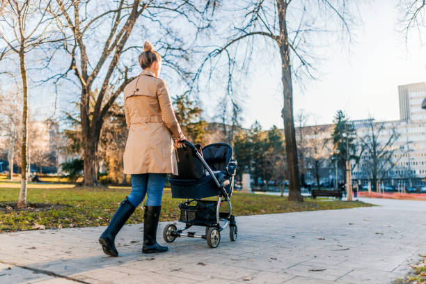 istock Mother taking her baby to the park in a stroller 898803006