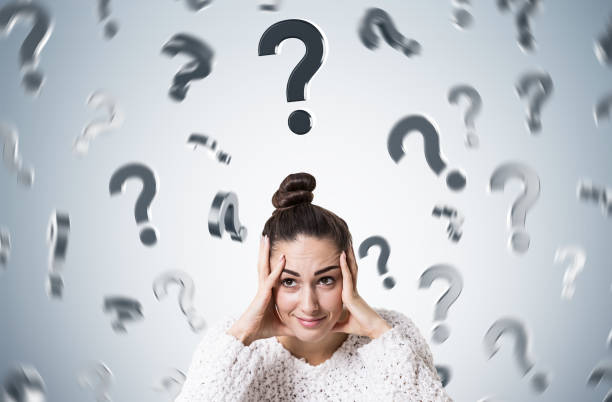 istock Stressed young woman with a bun, many questions 898806308
