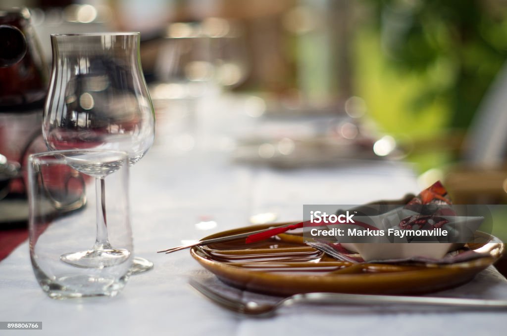 Plate and cutlery with christmas decoration Plate, cutlery, glasses and more decoration items in festive red and white christmas decoration style Pair Stock Photo