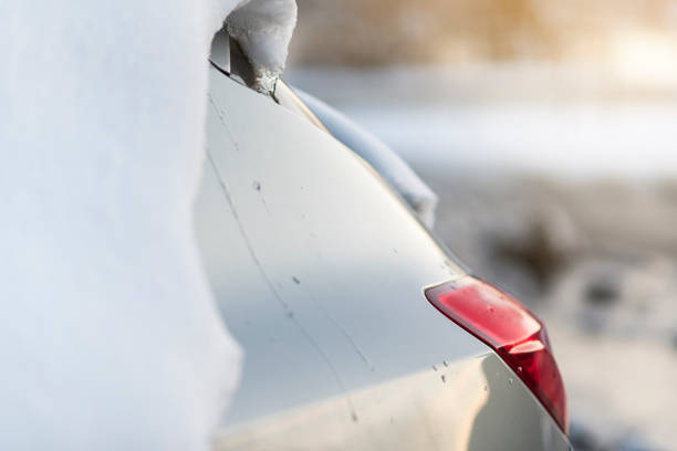 Car covered by snow, design background, space for text, design background, postcard, sunlight, blizzard, close up