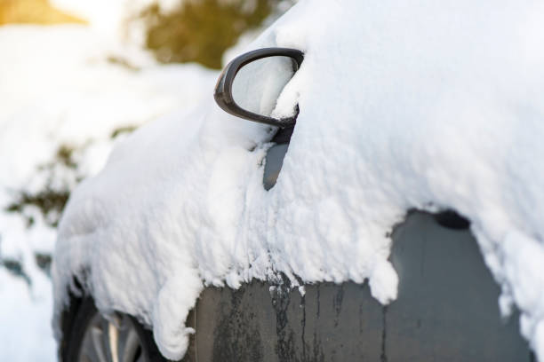 Car covered by snow, design background, space for text, design background, postcard, sunlight, blizzard, close up