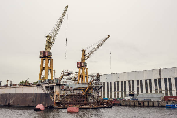 istock Cargo ship loading cranes in industrial zone on river, freight logistic transportation by water concept 898813568