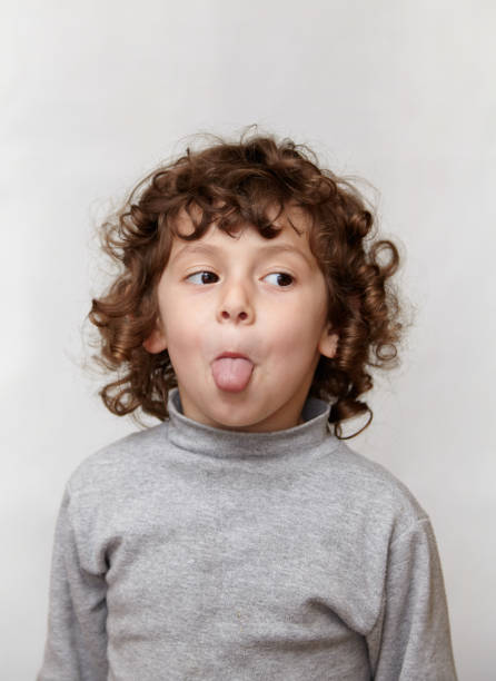 istock Child sticking out tongue 898820978