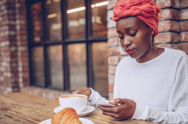 istock Woman having breakfast in cafe 898822040