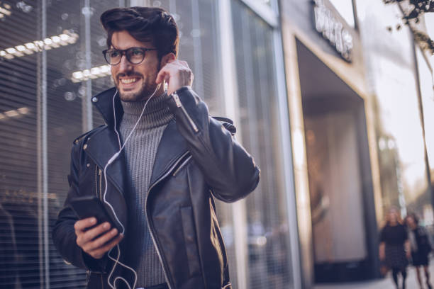 istock Handsome young man listening to some music 898828912