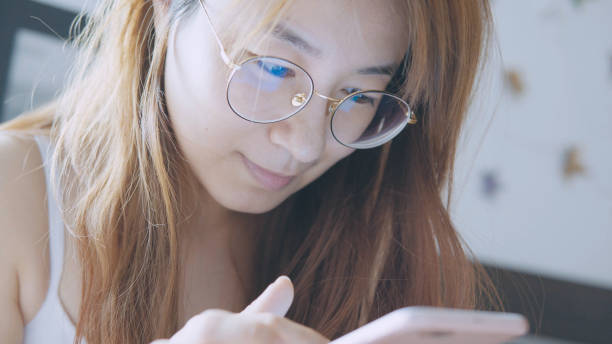 istock woman use phone on the bed 898838024