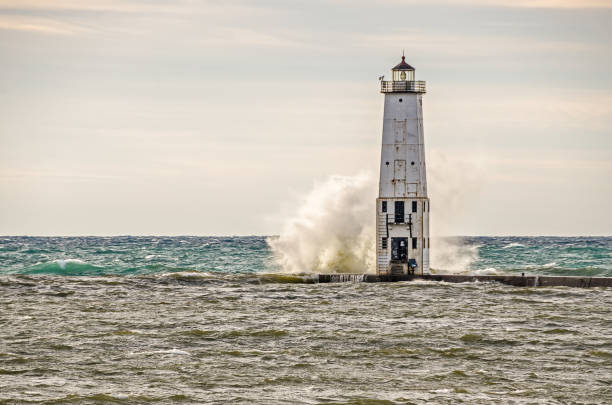 istock Wave Sprays Water Halfway Up the Lighthouse 898839042