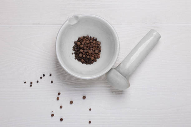 istock black pepper seeds in spice mortar 898843054