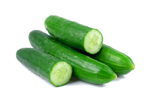 istock Cucumber and slices isolated over white background 898846956