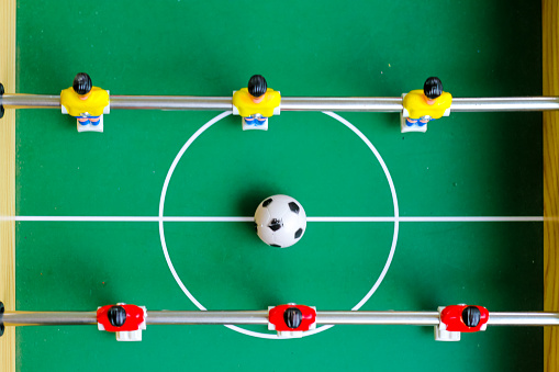 football table soccer, Table football game, Soccer table with red and yellow players.table football soccer game (kicker)