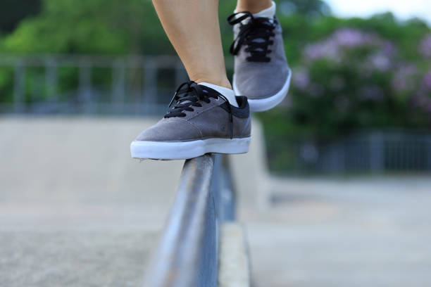istock legs walking on steel pipe with balance 898851294