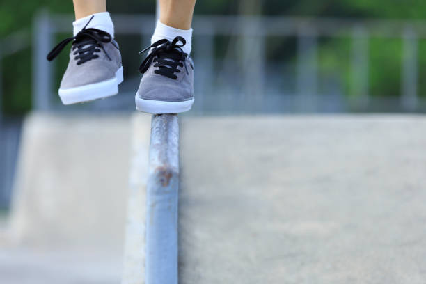 istock legs walking on steel pipe with balance 898852102