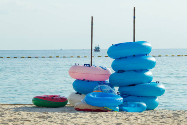 istock Rubber rings stacked at the beach. 898852112
