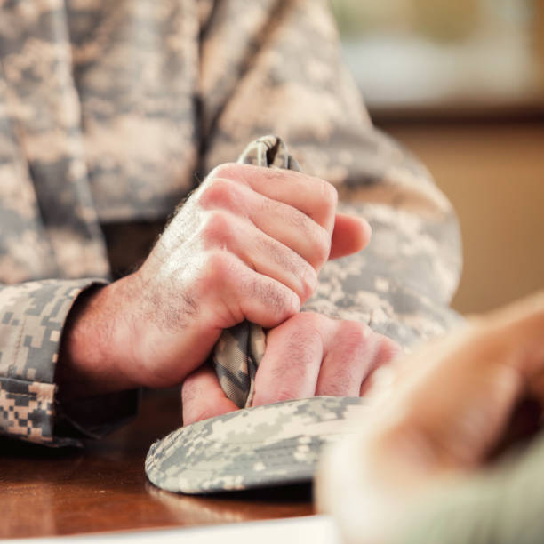 istock Unrecognizable soldier talks with mental health professional 898852212