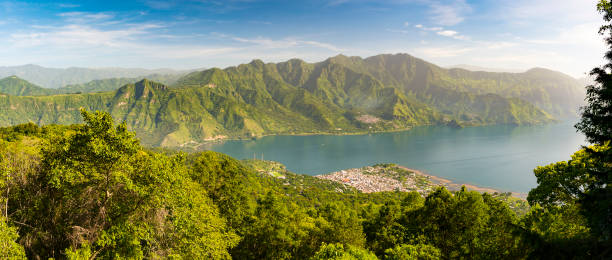 Panorama Of Lake Atitlan Panorama of Lake Atitlan with it's volcanic highlands guatemala landscape stock pictures, royalty-free photos & images