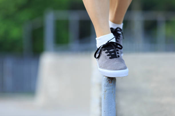 istock legs walking on steel pipe with balance 898852452