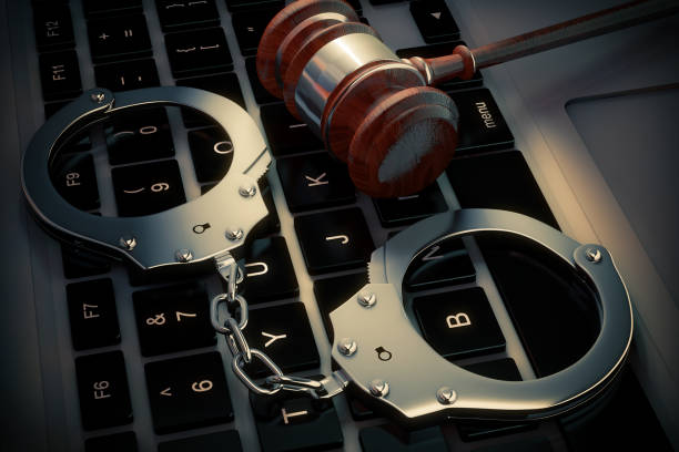 istock Cyber Crime Concept. Handcuffs and judge gavel on Laptop Computer. 3d Rendering 898853800
