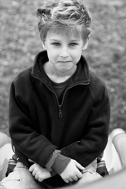 Sad face on a lonely bullied child