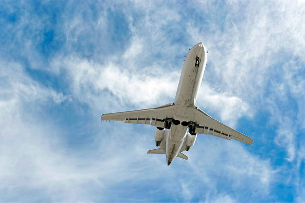 istock XXL corporate jet airplane landing in bright sky 89885519