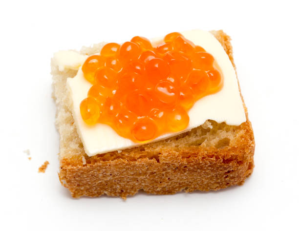 istock Red caviar sandwiches on white background 898857770