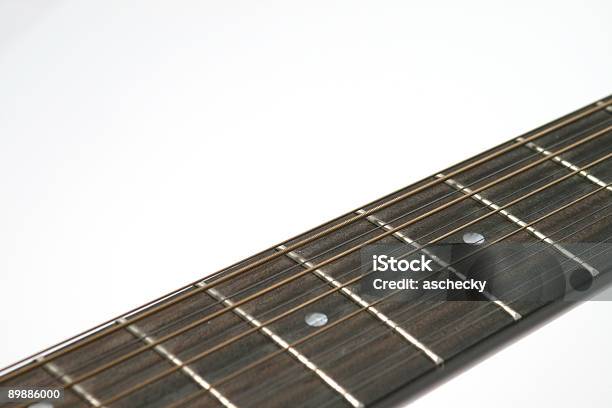 Foto de Doze String Guitarra Detalhe De Pescoço Contra Um Fundo Branco e mais fotos de stock de 12 Horas