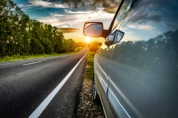 Car on roadside The car stopped at the roadside rural road. car-on-city-road-side-view stock pictures, royalty-free photos & images
