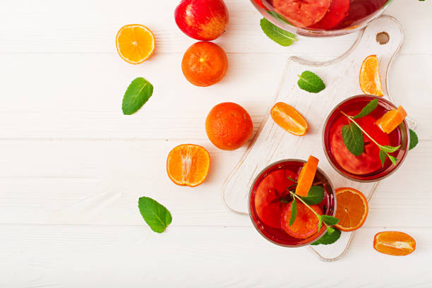 istock Sangria with fruits and mint on a white background. Top view 898867982