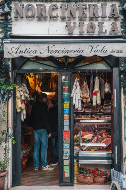 Rome, Italy - 13 December, 2015: Customer buying ham and cheese in Rome,Italy. The shop is famous for its ham and cheese.