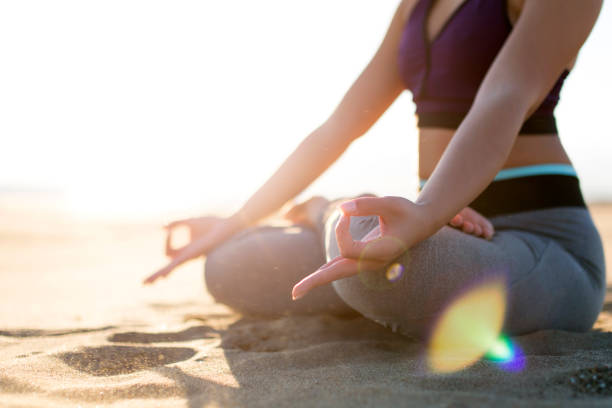 istock Yoga on the beach 898870014