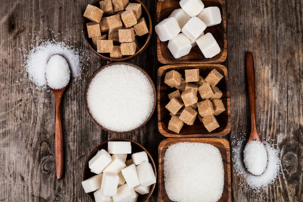 istock Bowls with sugar and  wooden spoons 898872496