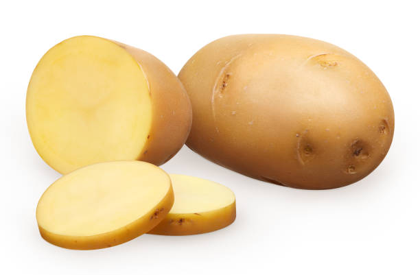 istock Whole fresh unpeeled potato, half and two chopped pieces 898874070