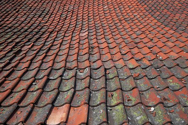 bricks on tiled roof background stock photo