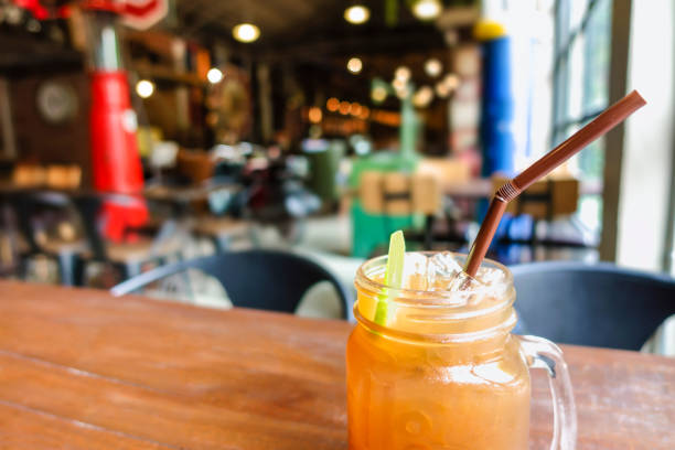 Ice lemon tea with slice of lemon in mason jar