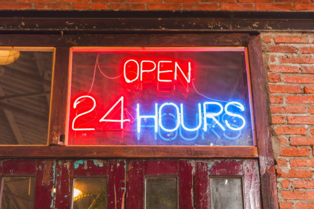istock Close up open 24 hours sign on the old crimson door 898878366