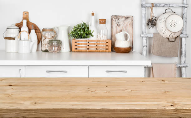 istock Brown wooden texture table over blurred image of kitchen bench 898881790