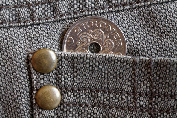 istock Denmark coin denomination is two krone (crown) in the pocket of brown denim jeans 898885708