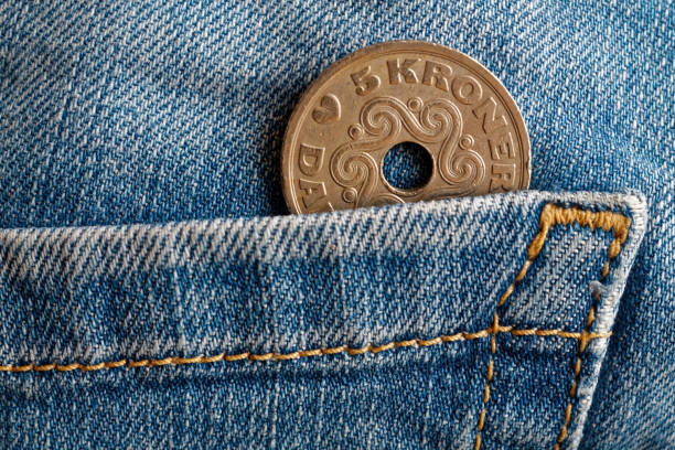 Denmark coin denomination is 5 krone (crown) in the pocket of old blue worn denim jeans Denmark coin denomination is five krone (crown) in the pocket of old blue worn denim jeans elefant stock pictures, royalty-free photos & images