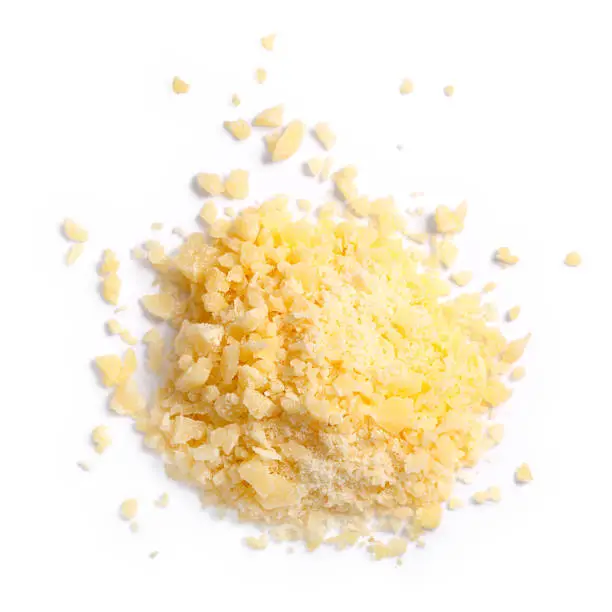 Grated Parmesan cheese (Parmigiano, Grana), pile of, top view. Clipping paths, shadows separated