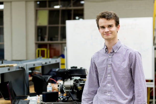 istock Portrait of a young electrical engineer by his project. 898886698
