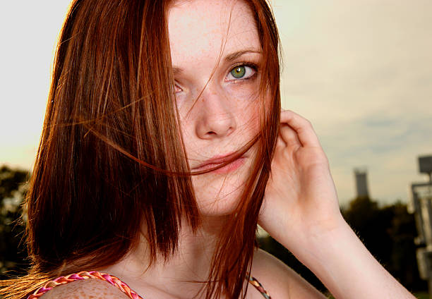 istock Young Red Haired Woman Windy Outdoors 89888967
