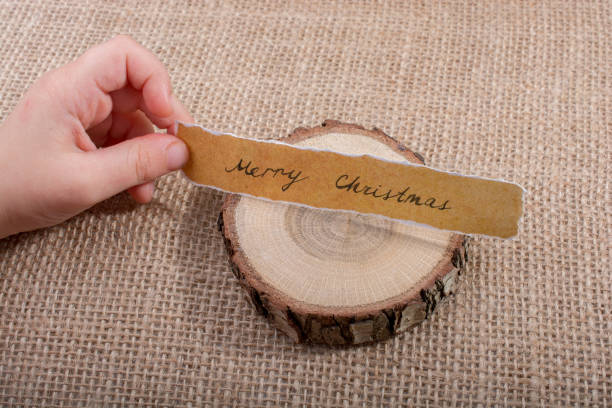 istock Merry Christmas  written on a torn paper 898889702