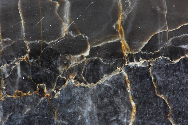 istock Close up of Patterned natural of dark gray marble (Gold Russia) texture for design. High resolution background. 898890412