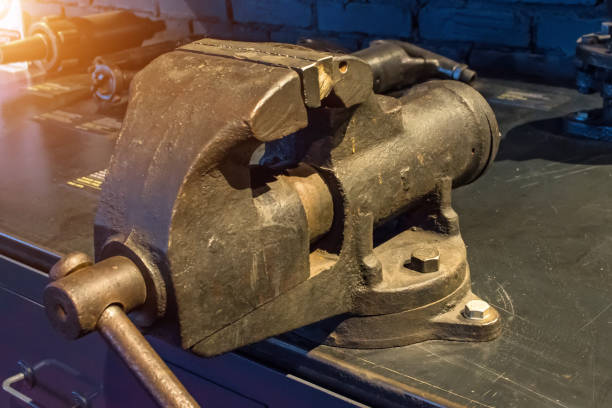 istock Old metal vise on the table tool. 898891026