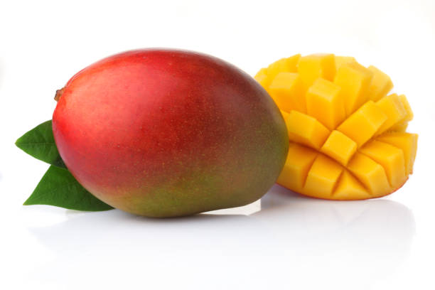 istock Ripe mango fruits with slices isolated on white 898891436