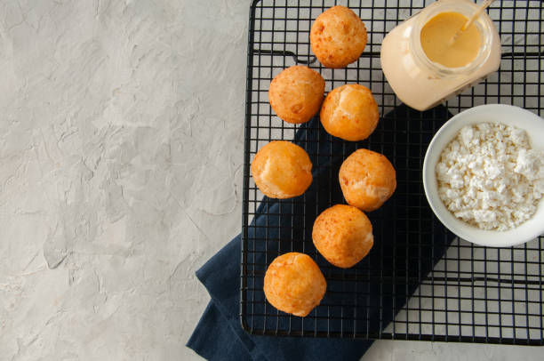 istock Small cottage cheese doughnuts (castgnole) with vanilla curd served in a vintage bowl. 898891978